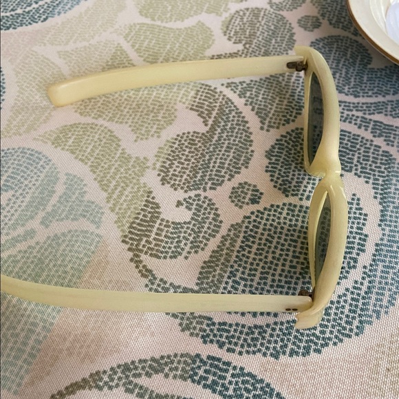 Vintage Cream Sunglasses with Embellishments
Polaroid main image 6